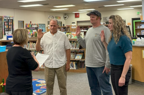 Photo by Trinity Baughn of Craig Pedro, Tyler Piche, Rachel Beckham being sworn in to Sonora Elementary School Board