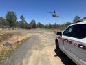 CAL FIRE copter 606 assisting in cyclist rescue on Red Hills Road in the area of Chinese Camp in Tuolumne County—CAL FIRE TCU photo