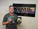 Maxx Wheeler with new book - Photo by BJ Hansen