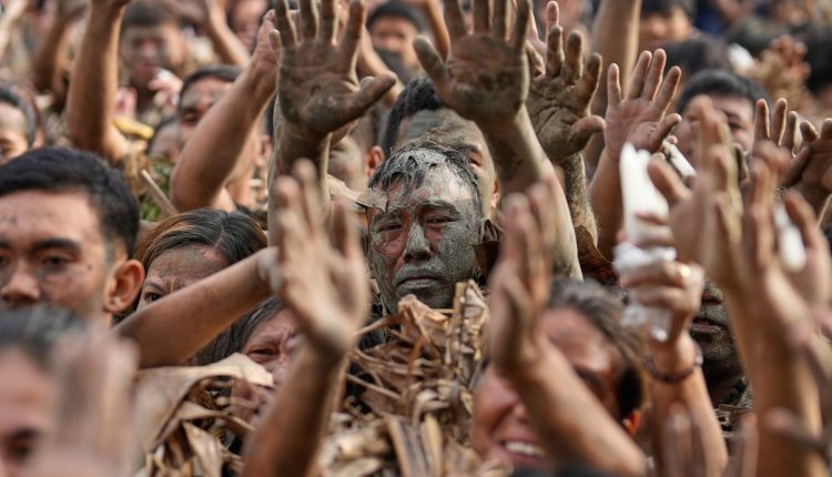 APTOPIX Philippines Mud Festival Photo Gallery