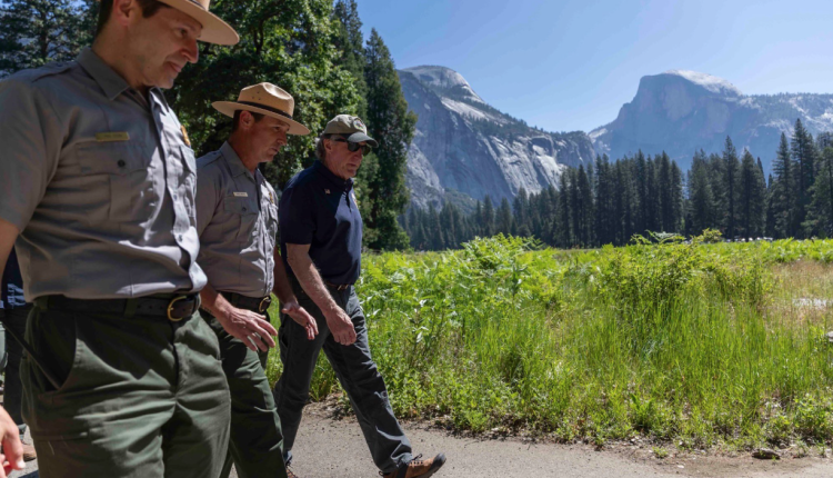 Doug Burgum walks with park rangers in Yosemite - Interior Department Image