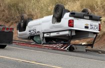 Chevy pickup overturned onto shoulder of Highway 108—Photo by Chip Waters