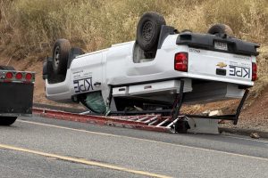 Chevy pickup overturned onto shoulder of Highway 108—Photo by Chip Waters