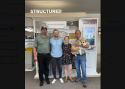 (L-R) Justin Gates (Managing Partner and Operations Manager), Petter Fritz (Managing Partner, CRO, and Son-in-law of Dan Pinnell), Ashley Pinnell (Marketing Manager, daughter of Dan Pinnell, spouse of Petter), and Dan Pinnell (founder, holding grand-pup Lucy).
