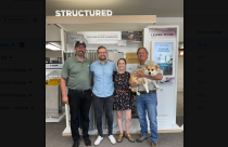 (L-R) Justin Gates (Managing Partner and Operations Manager), Petter Fritz (Managing Partner, CRO, and Son-in-law of Dan Pinnell), Ashley Pinnell (Marketing Manager, daughter of Dan Pinnell, spouse of Petter), and Dan Pinnell (founder, holding grand-pup Lucy).