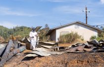 Inspecting Dove Fire impacts to identify potential hazards and determine what cleanup efforts may be needed—TCSO photo