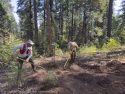Volunteers learning sustainable trail design—STF photo