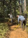 Volunteers learning sustainable trail design—STF photo