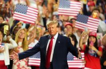 Trump takes center stage at Republicans’ first midterm convention, in photos