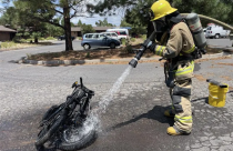 A firefighter extinguishes an e-bike fire in Grand Canyon National Park, July 21, 2026. - NPS