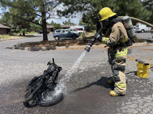 A firefighter extinguishes an e-bike fire in Grand Canyon National Park, July 21, 2026. - NPS