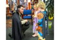 Tuolumne County Sheriff David Vazques handing out candy at the Tuolumne County Library's Story Time Trick-or-Treat—TCSO photo